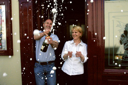 Mullingar millionaires! Kevin ‘Sham’ Geoghegan and Carol Loran celebrate their big win outside Dolan’s Bar, Mullingar after scooping Wednesday night’s €10.5 million Lotto jackpot. Photo: molloyphotography