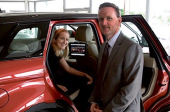 Nicola O'Connor of Screenway presents Robert Bradley of Bradley Motor Works with the new in-car iPad system which is on display in the Dublin Road showrooms.