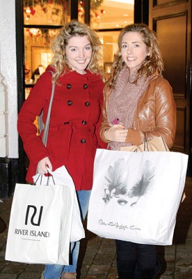 Breffni Molloy of Milltown and Danielle Carroll of Tuam getting their Christmas shopping all wrapped up on Monday in Galway