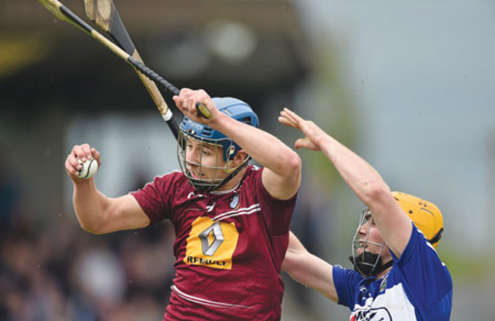 Robbie Greville, Westmeath, in action against Conor Dunne, Laois at last Sunday’s All-Ireland Senior Hurling Championship Qualifier Group - Round 2 in Mullingar. Photo: David Maher/ SPORTSFILE