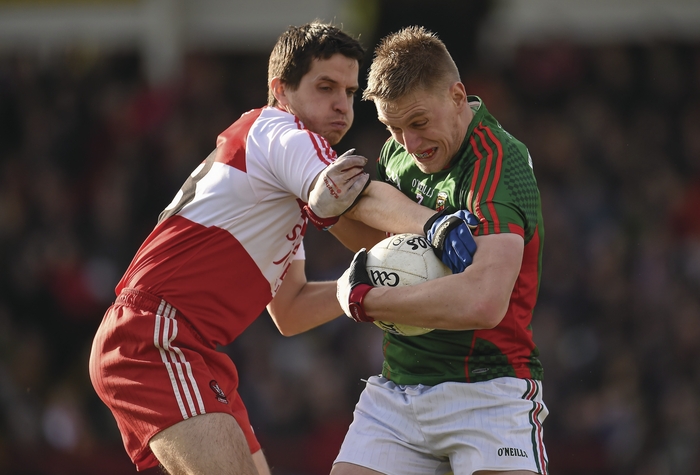 Man and ball: Kevin Keane does his best break out of defence against Derry. Photo:Sportsfile 