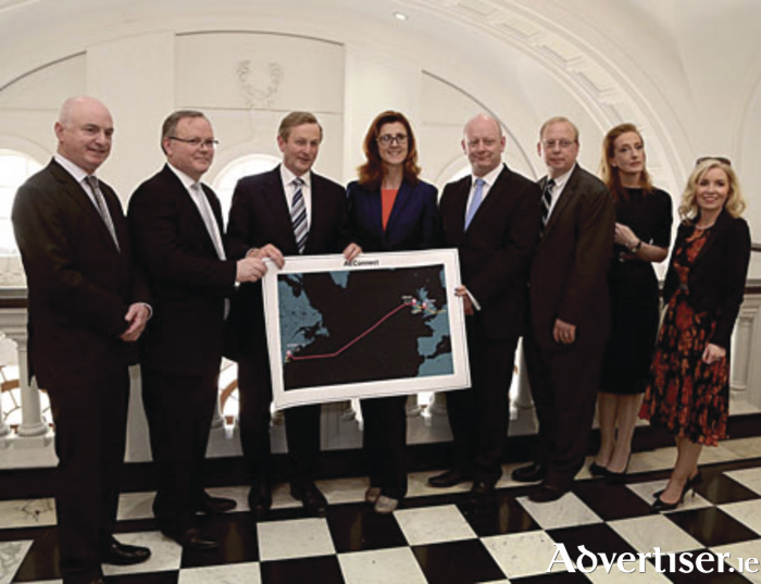 Peter Hynes, chief executive, Mayo County Council; Nicholas Hegarty, CEO AquaComms; An Taoiseach, Enda Kenny; Deputy Michelle Mulherin; Tom McMahon, Greg Varisco, and Caroll Browne, all AquaComms; and Joanne Grehan, head of Mayo’s enterprise and investment unit, at Government Buildings this week.