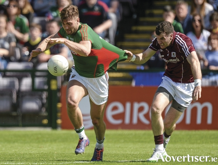 Come here to me: Aidan O'Shea's jersey is tested for strength by Johnny Duane in last Sunday's game. Photo: Sportsfile 
