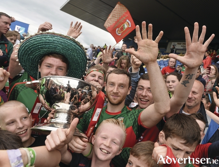 High Five: Keith Higgins celebrates Mayo's fifth Connacht title in a row with supporters after the game. Photo: Sportsfile 
