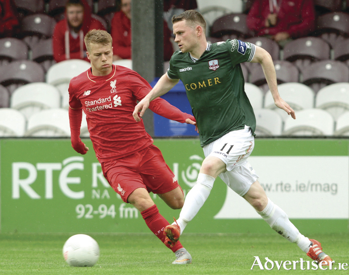 Galway United's Jason Molloy and Liverpool's Callum Nicholas in action from Galway United's friendly match against a Liverpool XI in Eamonn Deacy Park on Saturday. 
            
Photo:- Mike Shaughnessy