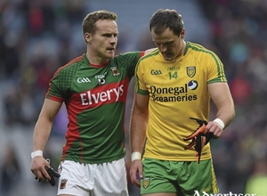 Knowing the pain: Andy Moran consoles Michael Murphy at full time. Photo:Sportsfile 