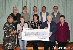 Pictured in Turlough Community Centre, members of the Turlough Card Club who presented a cheque for &euro;825.00 to St Brid&#039;s Special School Castlebar. The money was raised by holding a fundraising card game. Front row: Eileen Piggott, Mary Harte (Friends of St Brid&#039;s), Cathy Craughwell (principal, St Brid&#039;s), Mary Docherty and Maureen Flynn. Back Row: Carmel McSharry, Breta Fitzmaurice (Friends of St Brid&#039;s), Pat McHale, Jim Docherty, Michael Mahon. Photo: Ken Wright Photography 2015. 