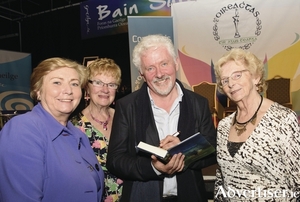 An Spid&eacute;al based writer Tadhg Mac Dhonnag&aacute;in at the recent Gradam U&iacute; Sh&uacute;illeabh&aacute;in Award ceremony, with (LtoR) Minister for Justice Frances Fitzgerald; Bl&aacute;thnaid U&iacute; Bhr&aacute;daigh, chair of Gradam U&iacute; Shuilleabh&aacute;in Literary Committee; and M&aacute;ir&iacute;n de Br&uacute;n, chair of Oireachtas na Gaeilge.