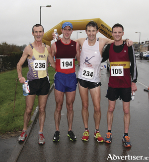 Winners at the Hollymount fiftieth Annual 10k Road Race were, left to right: Gerry Ryan (fourth, Croaghwell AC), Jason Broderick (Craughwell AC), Matt Bidwell (first, Galway City Harriers), Lewis Rodgers (Loftus and Whitby Club, Yorkshire). Photo:Trish Forde.