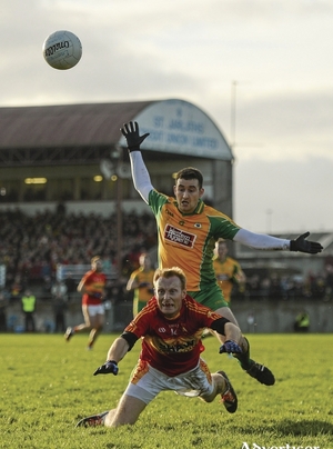 Man and ball: Richie Feeney and Alan Burke go for the ball in Tuam on Sunday. Photo: Sportsfile 