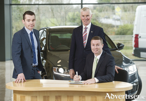 William Lee of Skoda Ireland with Al Hayes and Damien Hayes of Al Hayes Motors Ltd  as they sign the contract to become Skoda dealers for Clare. (Photo John Kelly) 