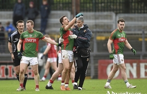 Lee Keegan is helped from the field, by Dr Sean Moffatt. Photo: Sportsfile 