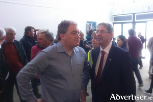 Galway West&#039;s first elected TD Eamon &Oacute; Cu&iacute;v in discussion with FF city councillor Ollie Crowe at the count centre on Sunday. Photo:- Kernan Andrews