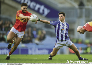 Ger McDonagh, Castlebar Mitchels, is tackled by Colm Basquel