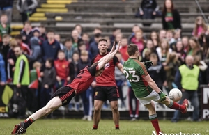Stroking it over: Andy Moran kicks a vital late point for Mayo against Down. Photo: Sportsfile 
