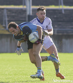 Salthill Knocknacarra&#039;s Ruaidhr&iacute; McTiernan and Catherlsitrane&#039;s Colm Monahan in action from the senior championship game at Tuam Stadium on Sunday.  		Photo:-Mike Shaughnessy