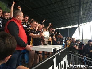 Champions time: Louisburgh captain Kevin Gibbons gets ready to lift the McDonnell Cup.