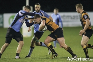 Buccaneers &lsquo;Ruairi Byrne charges at Galwegians, Ronan Moore in the Ulster Bank Rugby League division 1b clash at Dubarry Park on Friday night. Photo:-Mike Shaughnessy