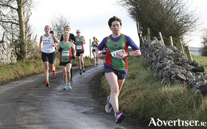 Noreen McManamon (Mayo AC) leads a group during the first lap of the women&#039;s 6k race at Hollymount Road Races.