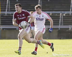 Galway&#039;s Damien Comer is chased by Cork&#039;s James Loughrey in action from the Allianz Football League Division 2 game at Pearse Stadium on Sunday. Photo:- Mike Shaughnessy