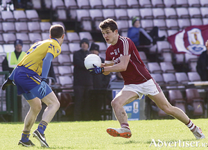 Galway&#039;s Michael Daly and Kwevin Harnett of Clare in action from the Allianz Football league game at Pearse Stadium on Sunday.					 Photo:-Mike Shaughnessy