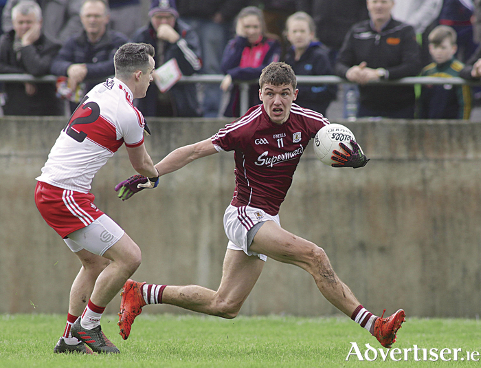 Galway's Michael Daly and Derry's Carlus McWilliams in action from the Allianz Football league game at Tuam Stadium on Sunday. Photo:-Mike Shaughnessy