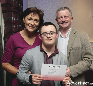 Davis McAnena with his proud parents Monica and Frank at the Kumon graduation ceremony at the Menlo Park Hotel on Thursday. Photo: Mike Shaughnessy.