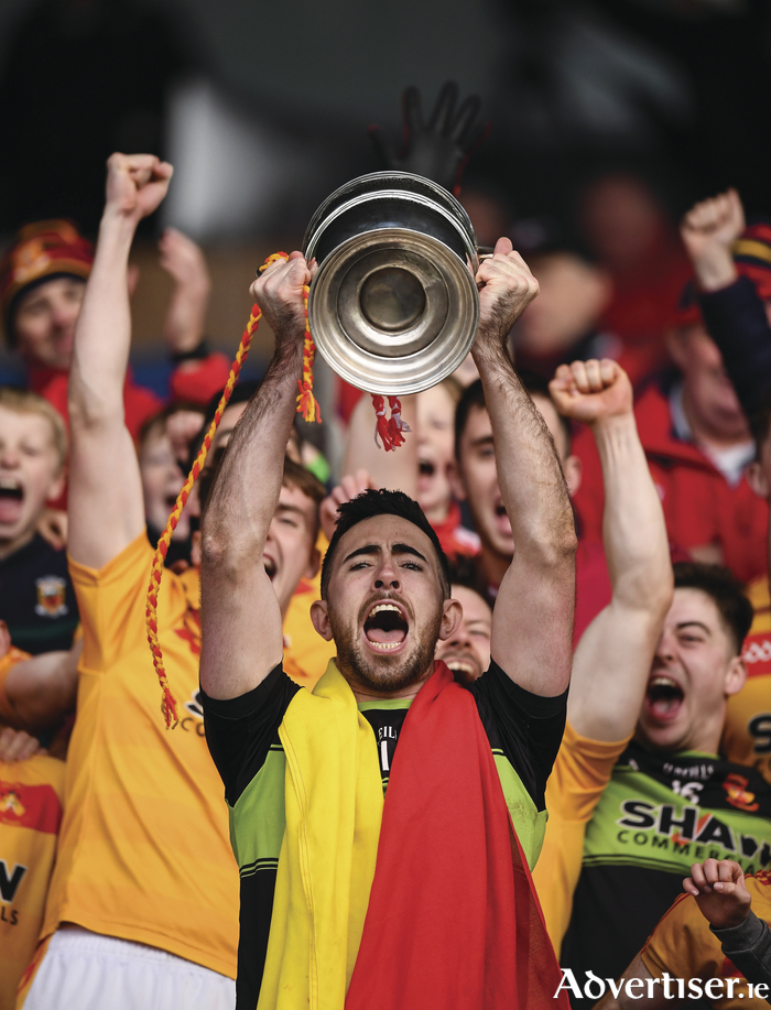 Three of the best: Castlebar Mitchels captain Rory Byrne lifts the Moclair Cup. Photo: Sportsfile