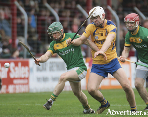 Craughwell&rsquo;s Gerard O&rsquo;Halloran holds off Portumna&rsquo;s in action from the Galway Senior Hurling Club quarter finals at Kenny Park, Athenry on Sunday. Photo:- Mike Shaughnessy