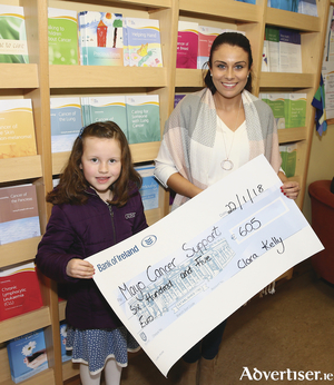 Six-year old Clara Kelly from Parke, Castlebar presenting a cheque to Trisha Greavy, General Manager of Mayo Cancer Support, Rock Rose House for ?605. Clara recently cut 16 inches off her hair and donated it to The Rapunzel Foundation and also raised money the local Cancer Support Centre. Photo: Michael Donnelly
