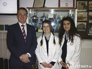 Second year students Aaliyah Clohessy and Ava McGahon represented Dominican College, Taylor&#039;s Hill, at the BT Young Scientist Exhibition where they presented an app called ReWire which enhances the attention span of  students while studying. Also in the photo is the principal of Dominican College, Alan Kinsella.
