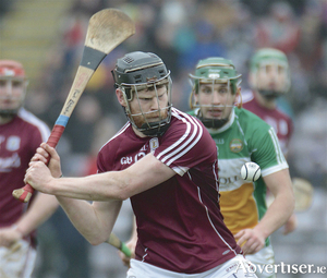 Galway&#039;s Paul Flaherty clears the sliotar watched by Offaly&#039;s David King in the Allianz Hurling League division 1B round three at Pearse Stadium on Sunday. Photo:-Mike Shaughnessy