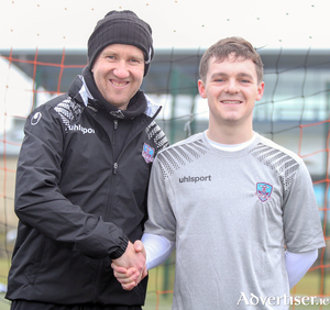 New signing Harrison Reeves is welcomed aboard by Shane Keegan.