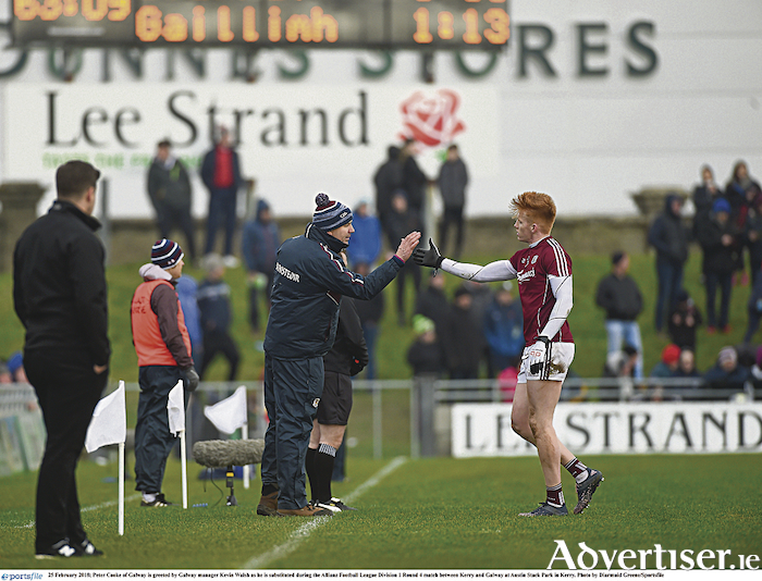 Feel good factor in Galway:  Manager Kevin Walsh  and Peter Cooke afer the recent win over Kerry, maintaining a strong run in the Allianz Football League.