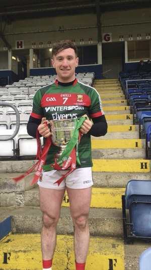Champions: Cathal Freeman with the league cup after Mayo&#039;s victory. Photo: Mayo GAA 