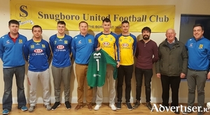 Conway Motors, Castlebar, presenting two new sets of jerseys to Snugboro United.