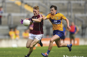 Galway captain Conor Raftery in action against Conor Carrig of Clare during the Electric Ireland GAA Football All-Ireland Minor Championship quarter-final against Clare in Tullamore, Co Offaly. Photo by Harry Murphy/Sportsfile