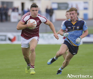 In flying form... Annaghdown&#039;s Damien Comer is chased by Salthill Knocknacarra&#039;s Eoin McFadden in action from the Galway senior club championship game at Kenny Park, Saturday.
Photo: Mike Shaughnessy