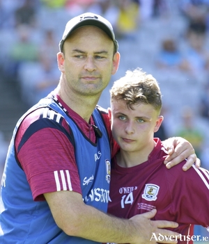 Galway manager Donal &Oacute; F&aacute;tharta consoles forward Daniel Cox iafter losing to Kerry in the All Ireland minor final at Croke Park, Sunday. 			Photo:-Mike Shaughnessy