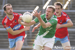 Moycullen&#039;s Padraig &Oacute; Loideain comes under pressure from Monivea Abbey duo of Barry McDonagh and Eoin Blade in action from the Galway Senior Football championship game at Pearse Stadium on Sunday. 
Photo:-Mike Shaughnessy