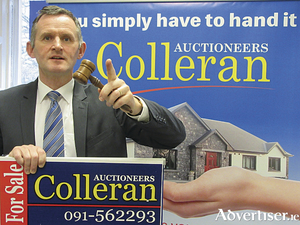 Auctioneer Don Colleran.