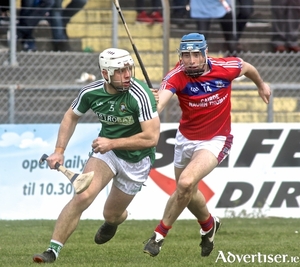 St Thomas&#039; Conor Cooney chases Mark Hughes of Liam Mellows in action from the opening game of the Salthill Hotel Senior Hurling Championship, Kenny Park, Sunday. Photo:-Mike Shaughnessy