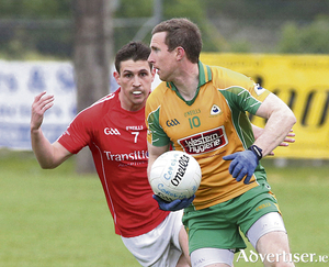 Gary Sice of  Corofin is chased by Alan O&#039;Connell of  Tuam Stars in action in round one of the Galway Senior Football Championships.