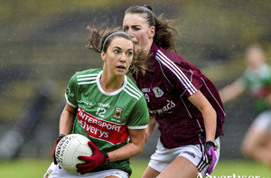 On the run: Niamh Kelly looks to create some forward momentum for Mayo. Photo: Sportsfile 