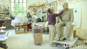 The artist Mark Richards creating the statue of Big Tom.