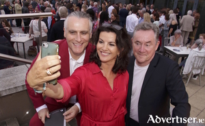 Comedian Deirdre Keane with Paul Fahy and John Crumlish of GIAF at the official opening of the Galway International Arts Festival hosted by the Galmont Hotel, Monday. Photo:- Mike Shaughnessy