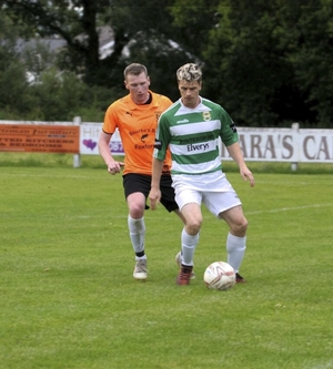 Neil Douglas holds up the ball for Castlebar Celtic last week. Photo: Castlebar Celtic Facebook