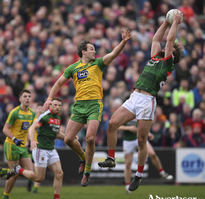 Up in the air: Aidan O&#039;Shea wins the ball despite the attentions of Michael Muprhy in a previous meeting of the counties. Photo: Sportsfile 