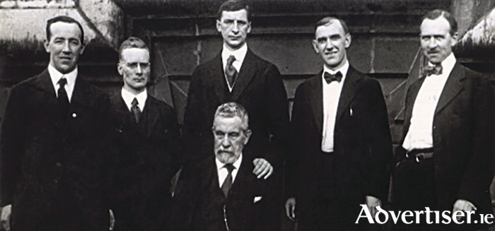  On top of the Waldorf-Astoria during de Valera&rsquo;s first press conference after his arrival in New York June 24 1919, are left: Harry Boland, honorary secretary Sinn F&eacute;in, Liam Mellows, Eamon de Valera, Diarmuid Lynch, secretary of Friends of Irish Freedom, and Dr Patrick McCartan, Irish envoy to Washington. Seated is John Devoy of Clan na Gael. (Note Dev&rsquo;s hand on Devoy&rsquo;s shoulder)