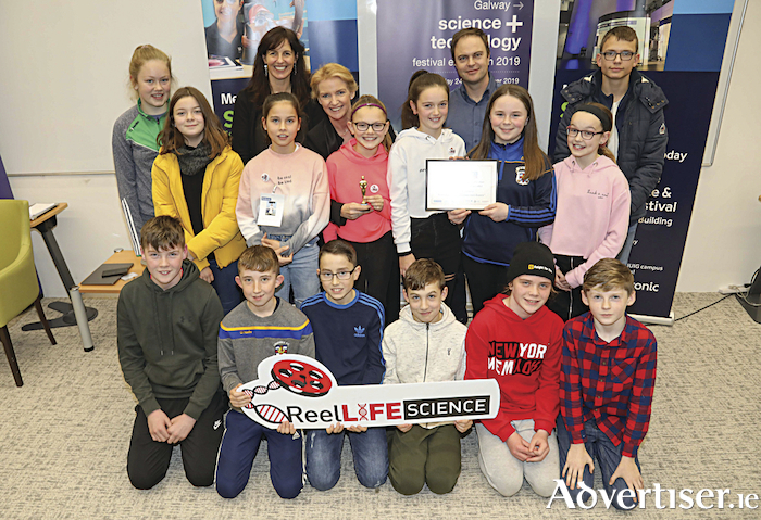 Students from Gaelscoil Riabhach, Loughrea, with Science Foundation Ireland head of education and public engagement Margie McCarthy; Met Éireann meteorologist Joanna Donnelly; and teacher Brian Ó Meacháin at the ReelLIFE SCIENCE Awards as part of the Galway Science and Technology Festival in NUI Galway.